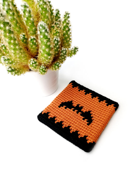 Spooky Halloween coaster with a bat