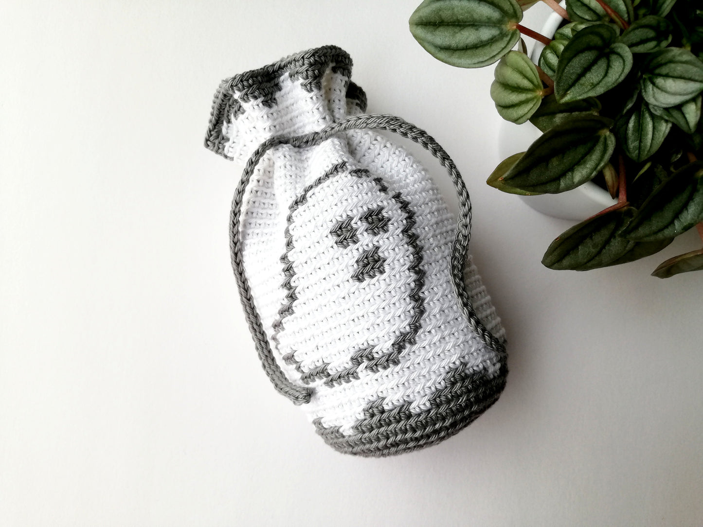 Crochet drawstring bag with a ghost